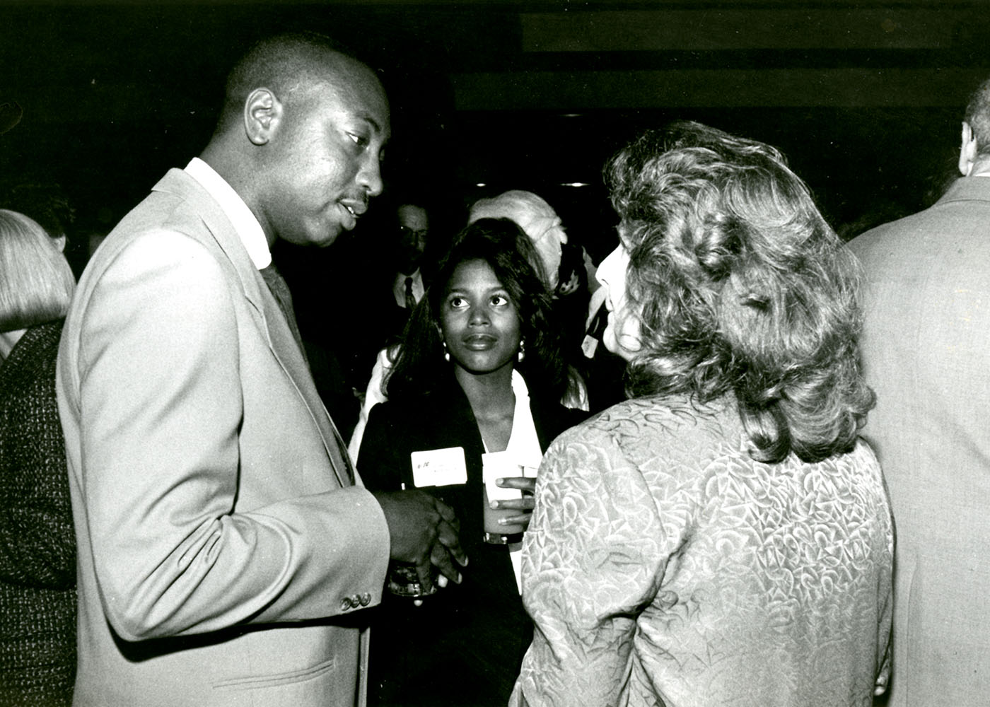 People conversing at the law school 20th Anniversary in 1992