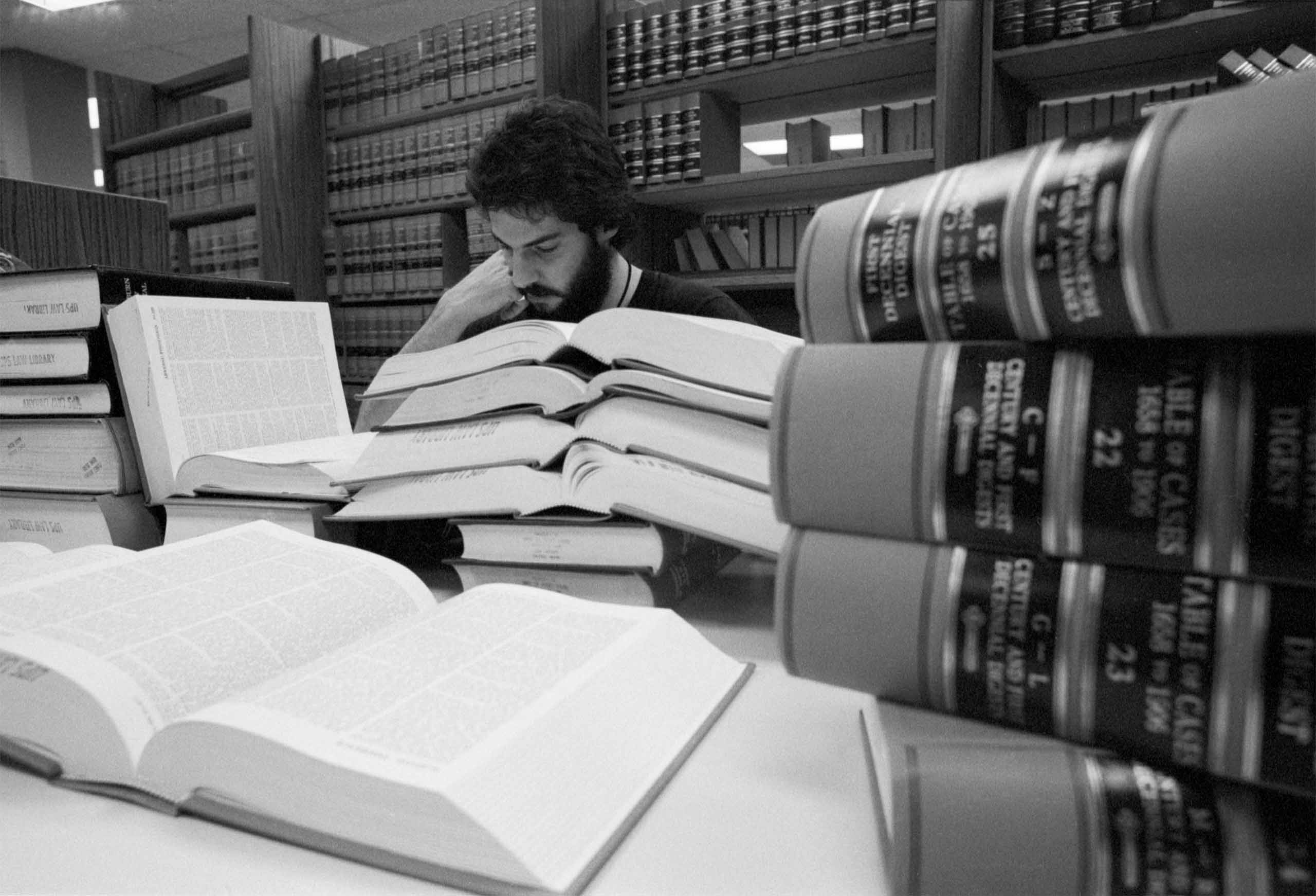Benaroya Business Park - A person at a desk behind a stack of law books