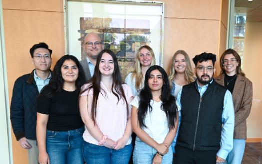 A group photo of TILE organization students posing in Sullivan Hall.