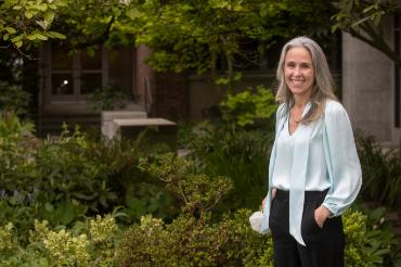Brooke Coleman standing near greenery