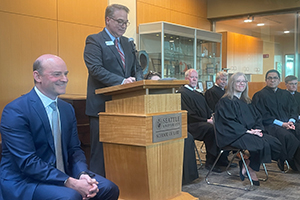 Dean Anthony E. Varona delivers remarks about Professor from Practice Leonard J. Feldman’s tenure at the law school.