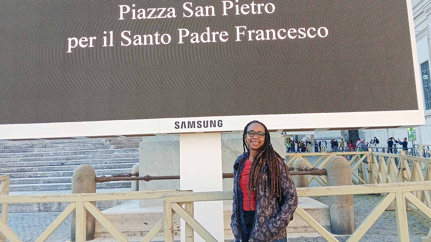 Professor Angela Harris stands in St. Peter's Square at the Vatican.