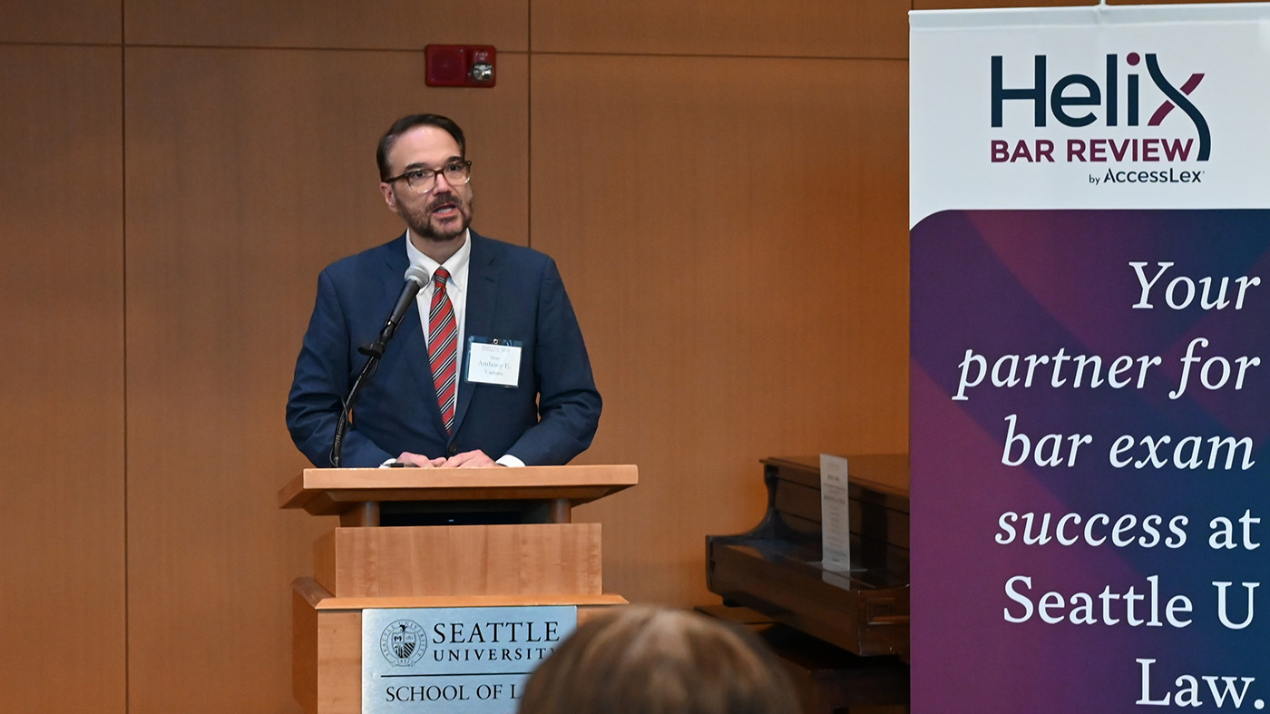 Seattle U Law Dean Anthony Varona at a podium at the law school
