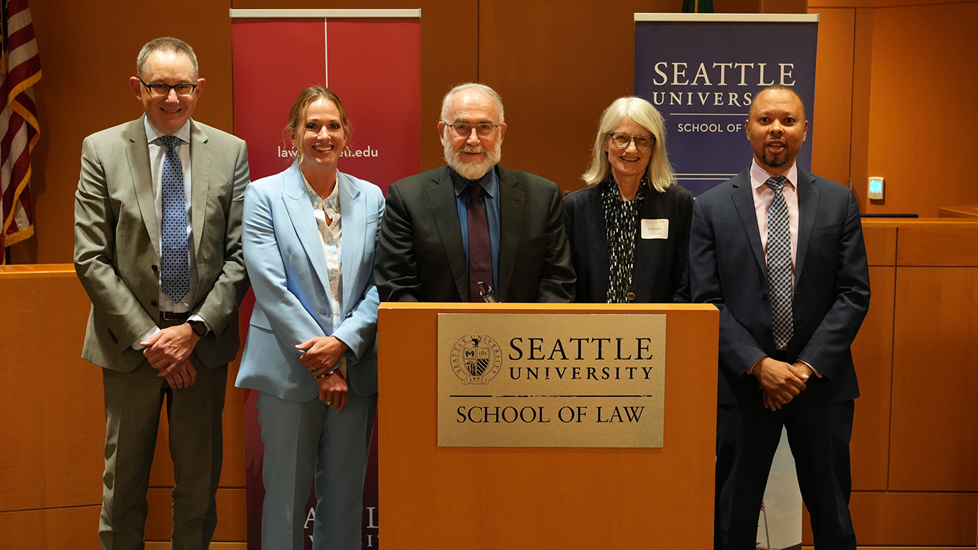 A group of speakers at the podium during the Defender Initiative Press Conference