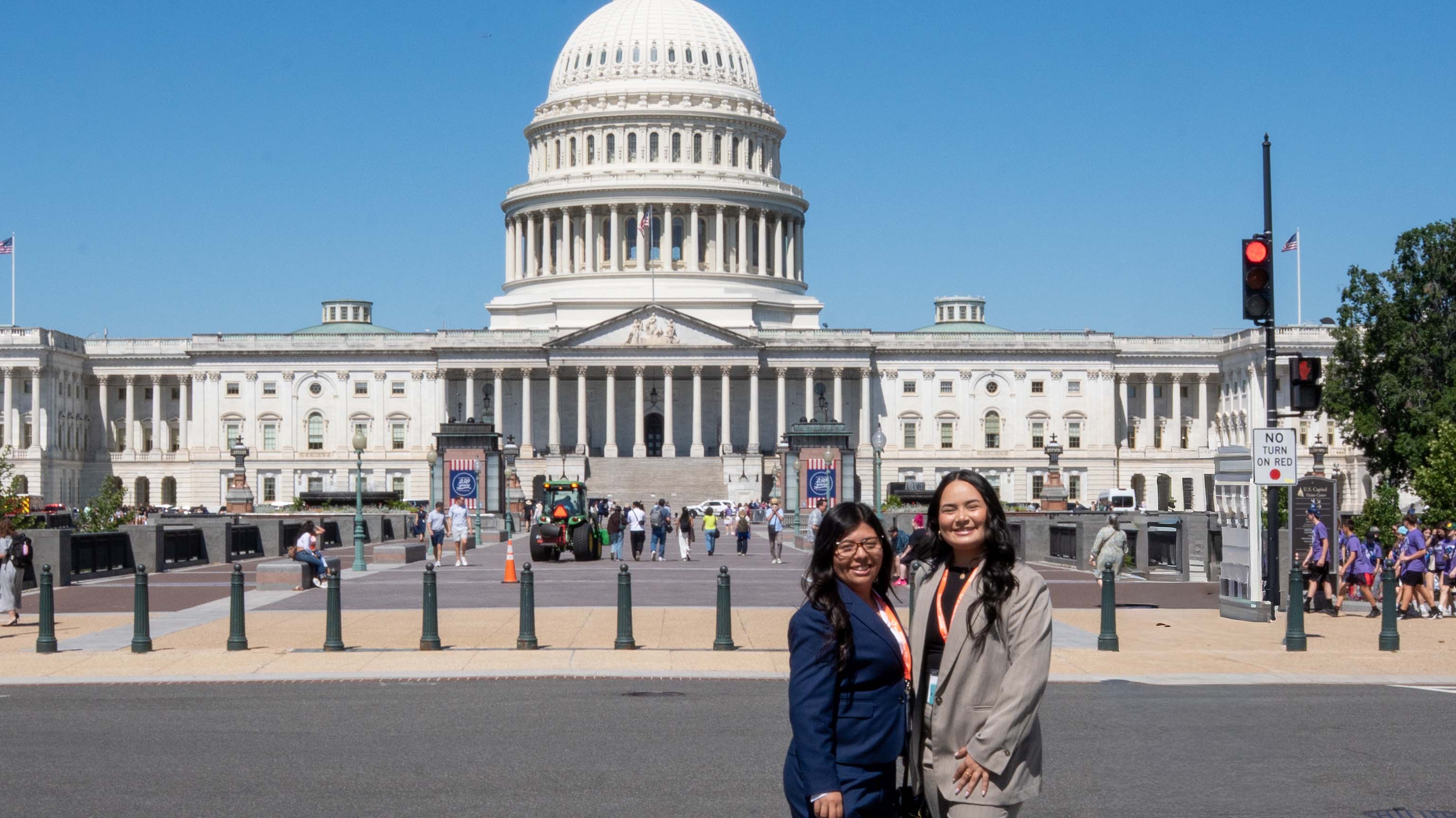 Students Ivett Martinez and Cristina Espinoza in front of the U.S. Capitol